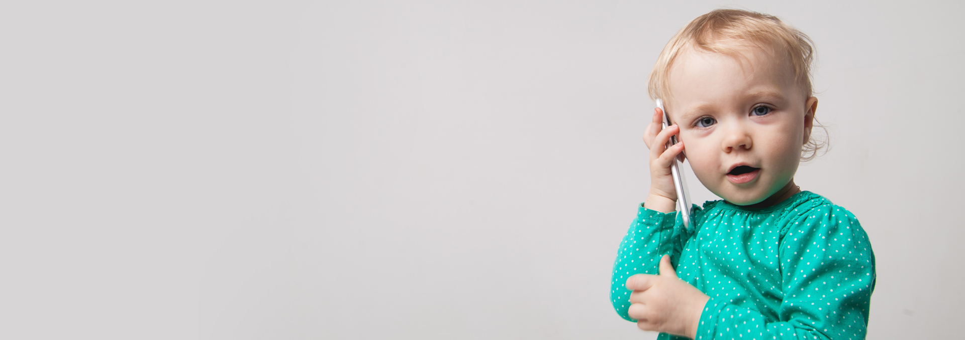 Chris standing up holding his daughter Elva